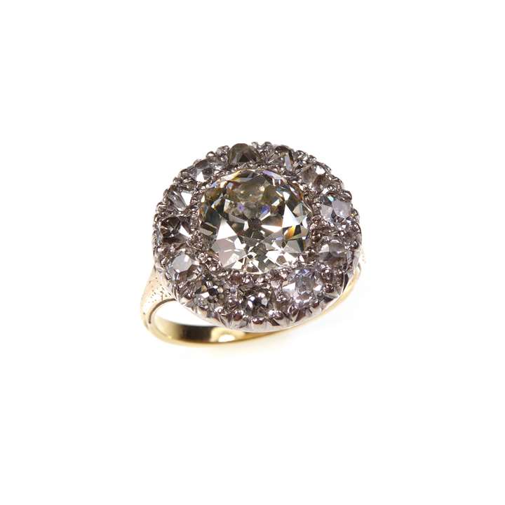 Diamond circular cluster ring with a central principal old cut diamond